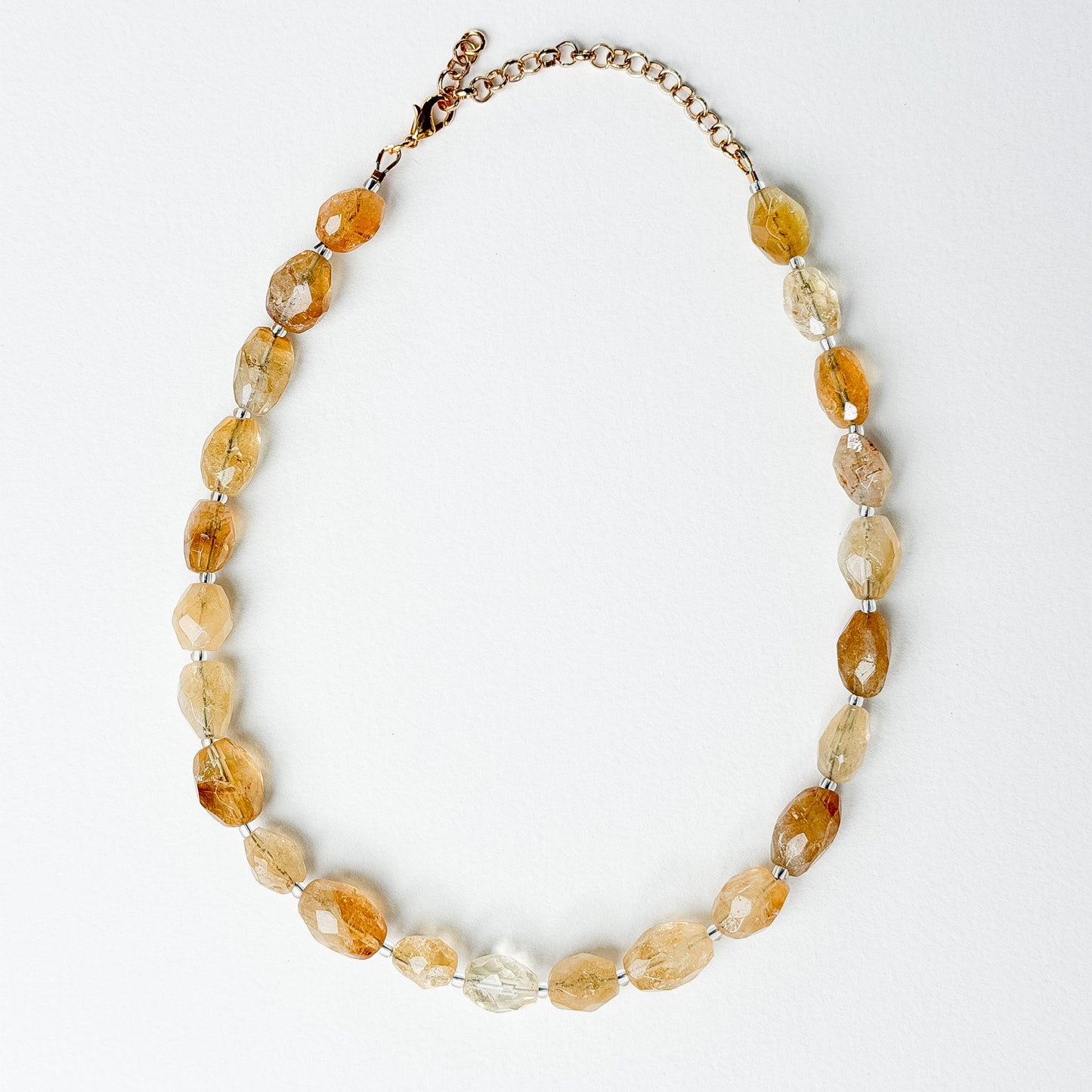 Solene citrine necklace laid flat