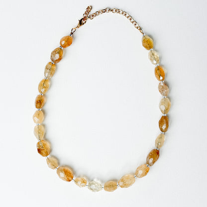 Solene citrine necklace laid flat