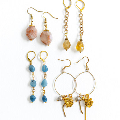 Aurelia gold hoop earrings on model